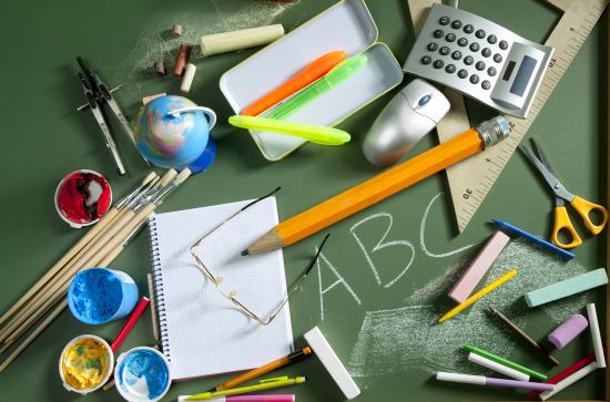 back to school concept with ABC written in school in green color blackboard